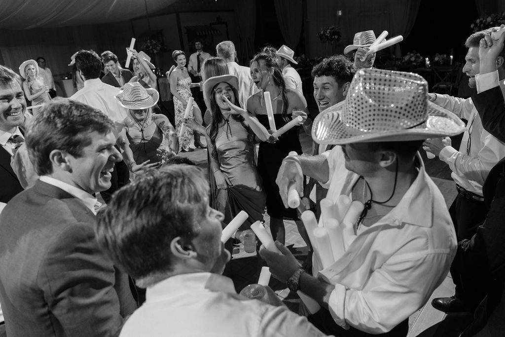Wedding guests celebrating on the dance floor